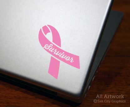 Survivor Awareness Ribbon (Breast Cancer) decal in Soft Pink (shown on laptop)