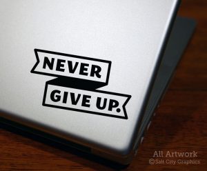 Never Give Up. Decal in Black (shown on laptop)