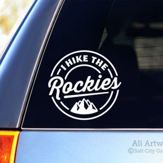 I Hike the Rockies Decal (with Mountains) in White (shown on SUV window)