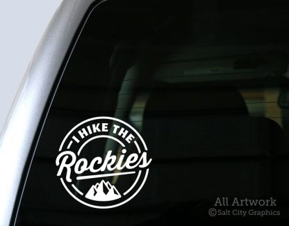 I Hike the Rockies Decal (with Mountains) in White (shown on truck window)