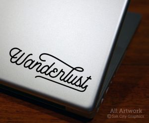 Wanderlust Decal (Typographic/Script) in Black (shown on laptop)