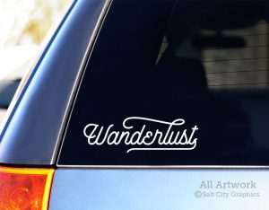Wanderlust Decal (Typographic/Script) in White (shown on SUV window)