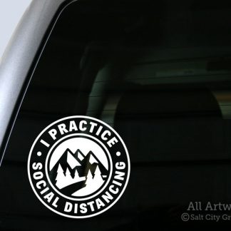 I Practice Social Distancing decal in White with pine trees and mountains (shown on truck window)