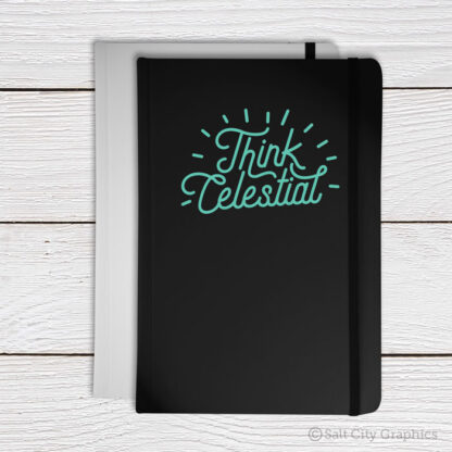 Think Celestial vinyl decal in Mint shown on black notebook or journal